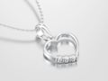 3D illustration white gold or silver diamond heart necklace on c Royalty Free Stock Photo