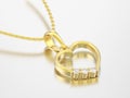 3D illustration yellow gold diamond heart necklace on chain Royalty Free Stock Photo