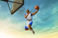 3d illustration young professional basketball player layup on the streets, city park at sunset sky Royalty Free Stock Photo