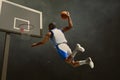 3d illustration young professional basketball player slam dunk on the streets at night Royalty Free Stock Photo