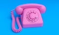 3d image , pink old phone,on a blue background, 3d rendering Royalty Free Stock Photo