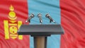 Podium lectern with microphones and Mongolia flag in background