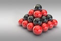 3D image of a pyramid of red and black balls in empty space Royalty Free Stock Photo