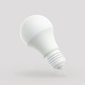 3D LED white light bulb on gray background. Royalty Free Stock Photo