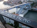 D.Luis bridge seen in the city of Porto. handrail with the written phrase, "amor proprio"