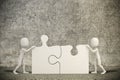 3d man joining two puzzle pieces Royalty Free Stock Photo