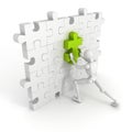 3d man put last green piece in jigsaw puzzle wall Royalty Free Stock Photo