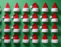 a 3d modeled cenital view, aerial view of a playful pattern design featuring many santa claus\'s hats partially embedded in a