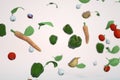 3d models of small vegetables in the air. Carrots, lettuce leaves, pepper, garlic, tomato, cabbage in the air on a white