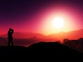 3D mountain range against a sunset sky with silhouette of a couple kissing Royalty Free Stock Photo