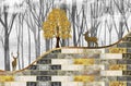 3d mural wallpaper. golden, gray and black wall bricks. golden tree and deers in light floral background