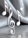 3D musical notes and treble clef against a soft gray background. Royalty Free Stock Photo