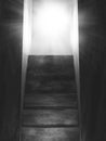 3D old concrete stairs leading to an open door with sun rays Royalty Free Stock Photo