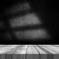 3D old wooden table against a grunge wall background Royalty Free Stock Photo