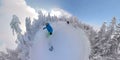 Winter wonderland world with two freeride snowboarders riding fresh powder snow Royalty Free Stock Photo