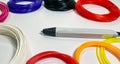3D pen for drawing three-dimensional objects made of plastic and a lot of multi-colored plastic for creating beautiful Royalty Free Stock Photo