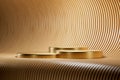 3d presentation pedestal made of gold over wooden background