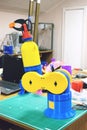 3D printed robot clamp, arm, holder. Plastic manipulator, robotic hand machine tool printed on three dimensional printer. DIY
