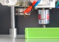 3d printer with bright green filament