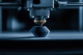 3D printer creates prototype model. Advanced manufacturing process with rapid prototyping tech. Close up shows 3D printing