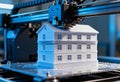 3d printer creating architectural model of residential building Royalty Free Stock Photo