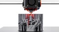 3D printer creating a detailed object with glowing hot end, close-up of additive manufacturing Royalty Free Stock Photo