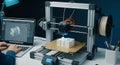 3D Printer Creating Object from Digital Design on Laptop Royalty Free Stock Photo