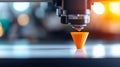 3D printer creating orange cone on table in laboratory setting showcasing advanced technology and precision in manufacturing Royalty Free Stock Photo