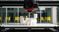 3D Printer Creating White Architectural Model in Modern Office Royalty Free Stock Photo