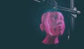A 3D-printer makes a humanoid head from pink plastic in a dark setting with futuristic illustration