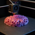 A 3D printer in operation creating a complex, lace-like object with an intricate pattern. Royalty Free Stock Photo