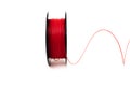 3D Printer Plastic Filament. Spool of red thermoplastic wire for 3d printing close up