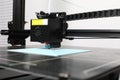 3D printer printing on a grid surface