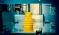 3d printer printing objects yellow form closeup. Royalty Free Stock Photo