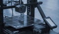3D printer printing prototype molten plastic Process of creating prototype model Royalty Free Stock Photo