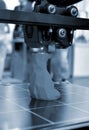 3D printer printing prototype molten plastic Process of creating prototype model Royalty Free Stock Photo