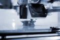 3D printer prints an object. The process of printing model on 3D printer Royalty Free Stock Photo