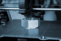3D printer prints object Process of printing model on 3D printer. Model printed Royalty Free Stock Photo