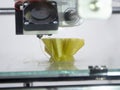 3D printer prints object Process of printing model on 3D printer. Model printed Royalty Free Stock Photo