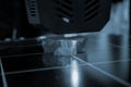 3D printer prints object Process of printing model on 3D printer Model printed Royalty Free Stock Photo