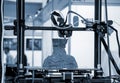 3D printer prints object Process of printing model on 3D printer Model printed Royalty Free Stock Photo