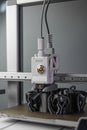 3D printer prints an object. The process of printing model on 3D printer. Model printed on 3D printer from molten