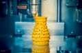 3d printer printing objects yellow form closeup. Royalty Free Stock Photo