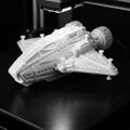 A 3D printer is in the process of creating a detailed model of a futuristic spacecraft. Royalty Free Stock Photo
