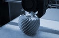 3D printer working and creating an object from the hot molten plastic