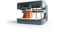 3 d printing machine creating orange object Royalty Free Stock Photo