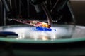 3d printing process close up. Automatic three dimensional 3d printer mechanism prints polymer blue part, component. Three