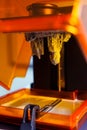 3D printing process. 3D printer for SLA stereolithography printing using photopolymer resin.