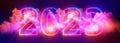 3d render, abstract background with neon numbers and clouds. New year 2023 glowing in the sky Royalty Free Stock Photo