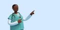 3d render. African young man, cartoon character nurse with dark skin wears mint green shirt, shows right direction with fingers.